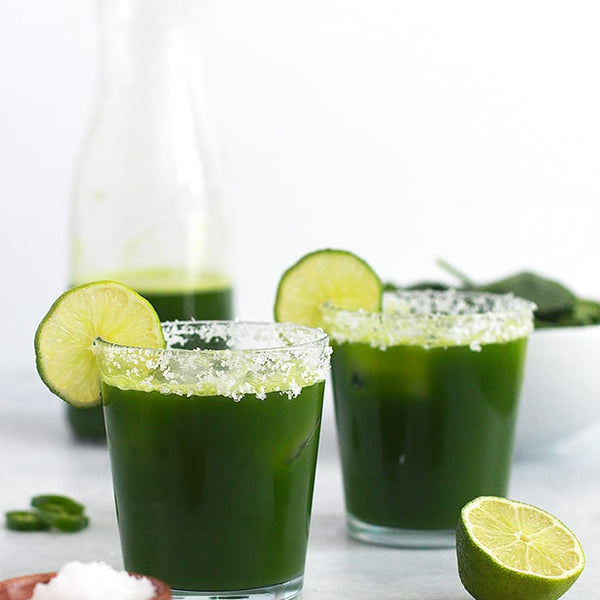 two short glass margaritas with salted rims